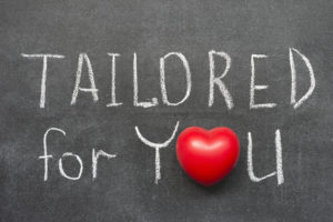 tailored for you phrase handwritten on blackboard with heart symbol instead of O